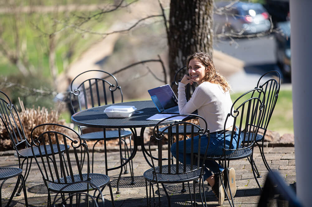 Woman seated outdoors