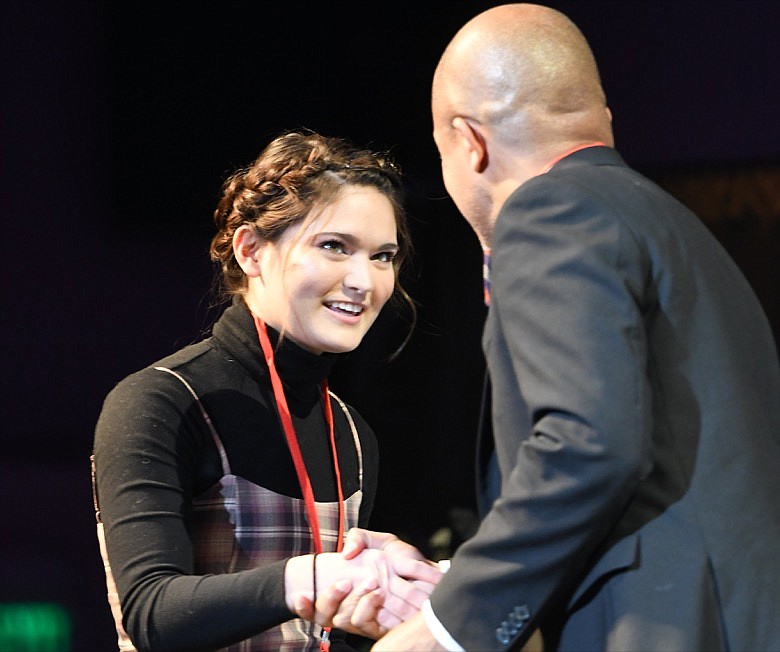 Madeline Miyashiro, of Collegedale Academy, receives her Comm Contest Award of $500 in the Writing category from Jason Merryman /©CTFP