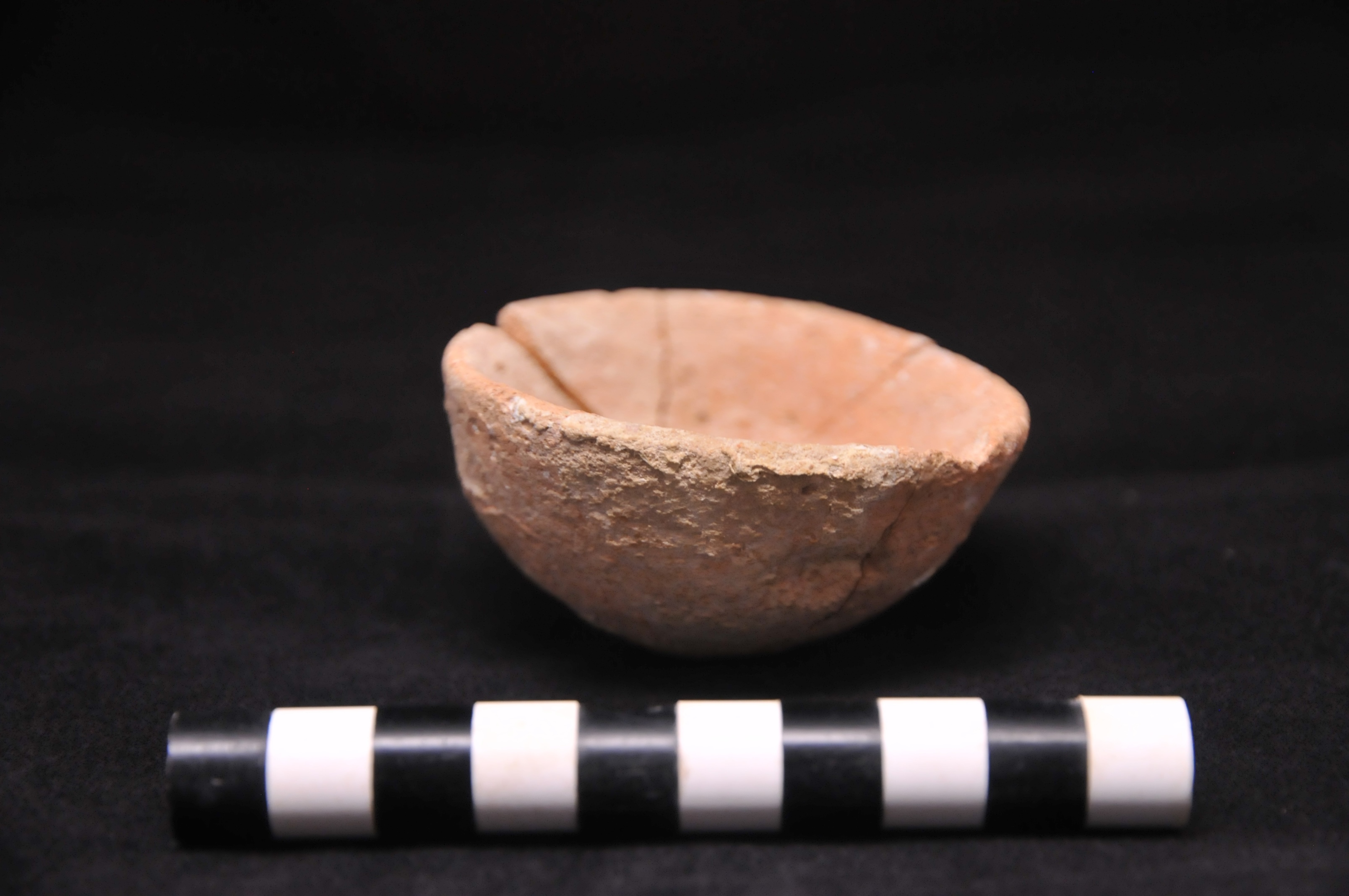 a lopsided tan bowl