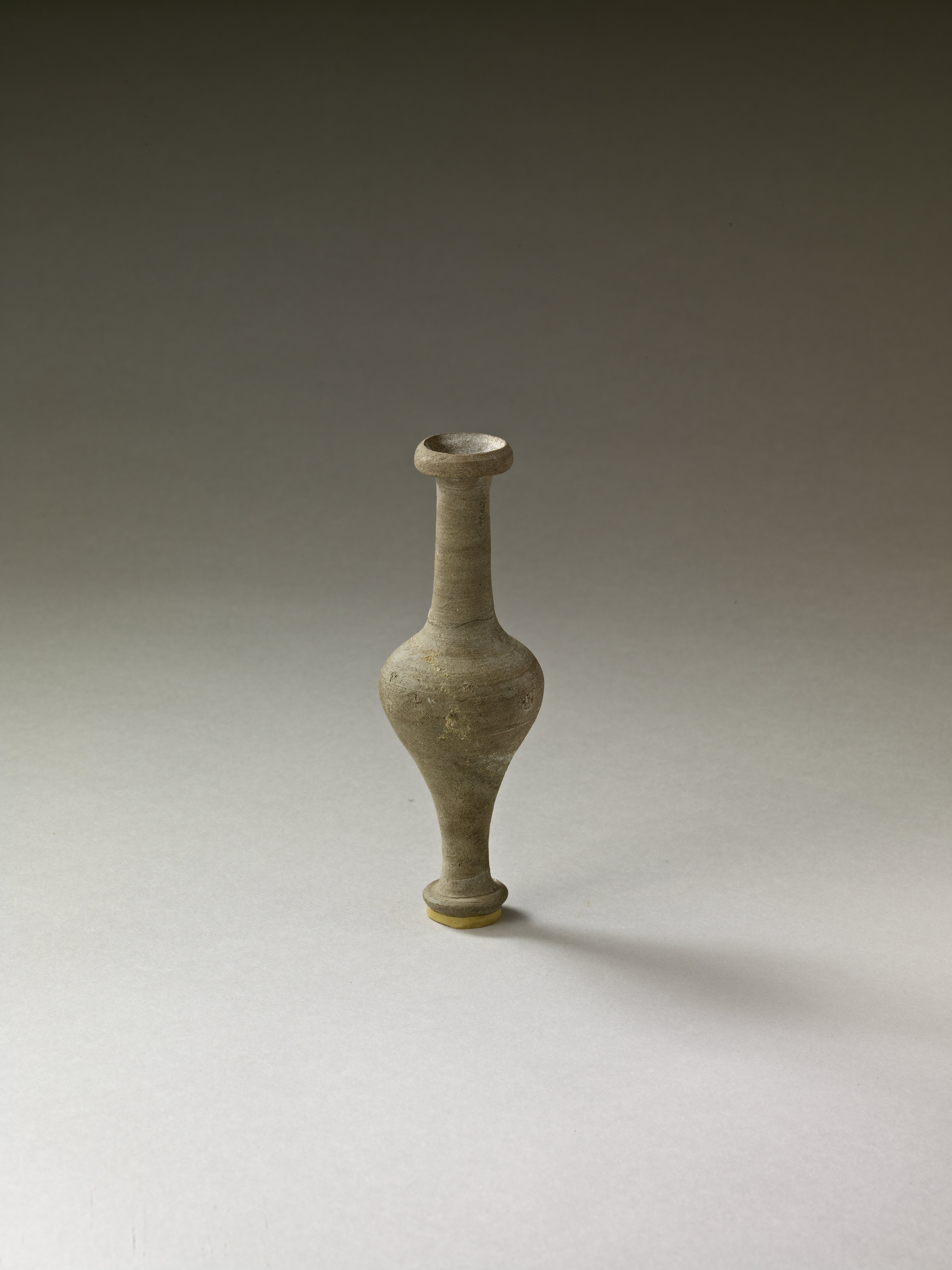 Small ceramic vial.