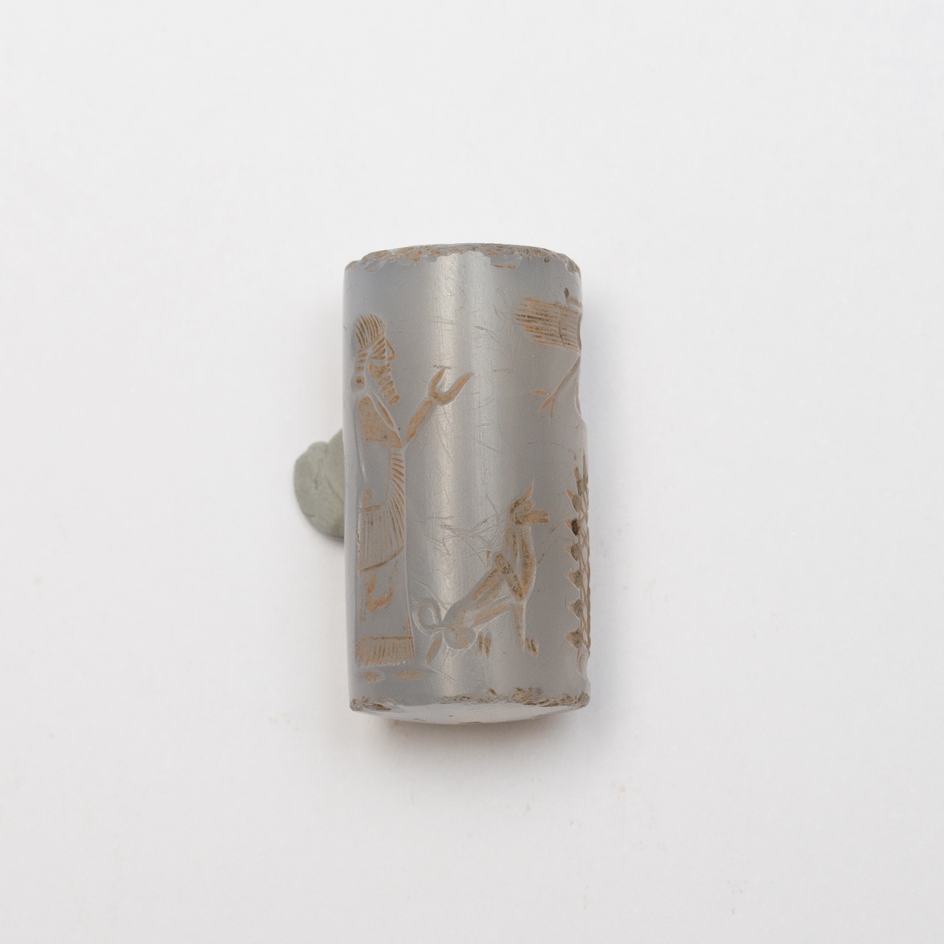 a cylinder seal made out of a blue precious stone