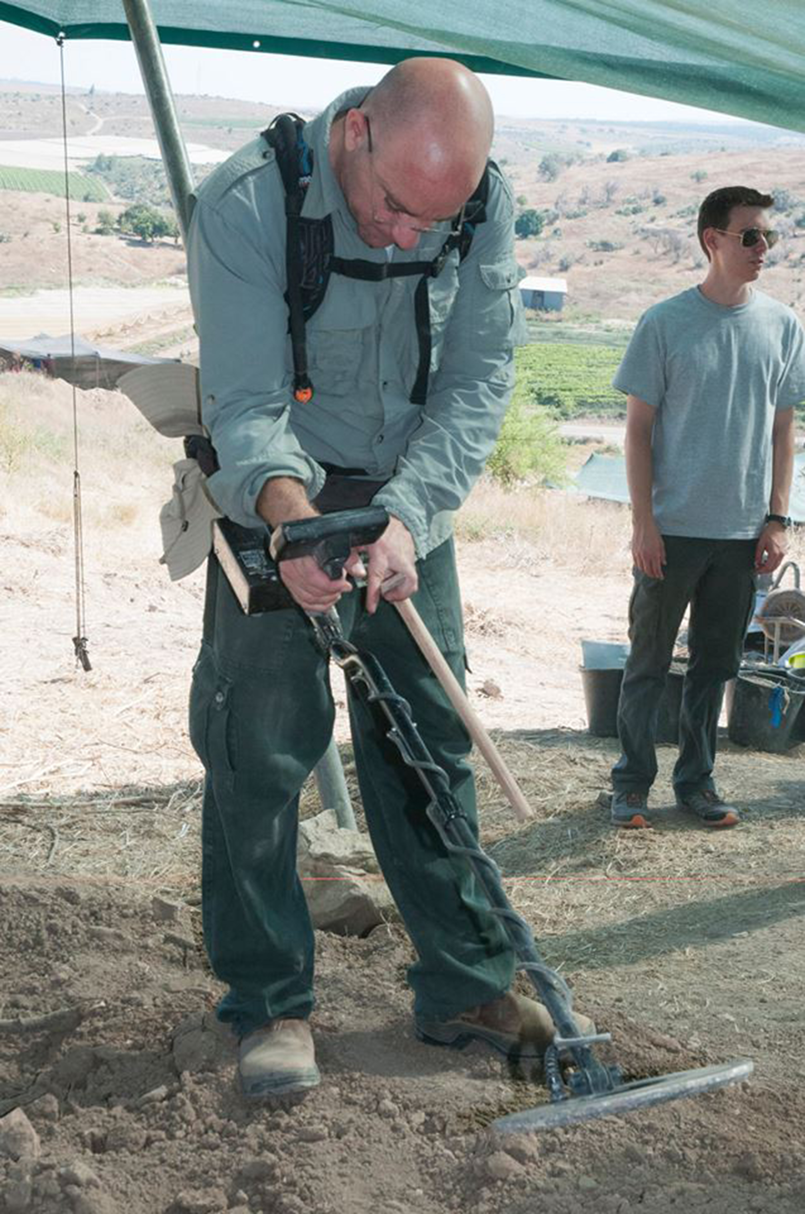 someone using a metal detector 