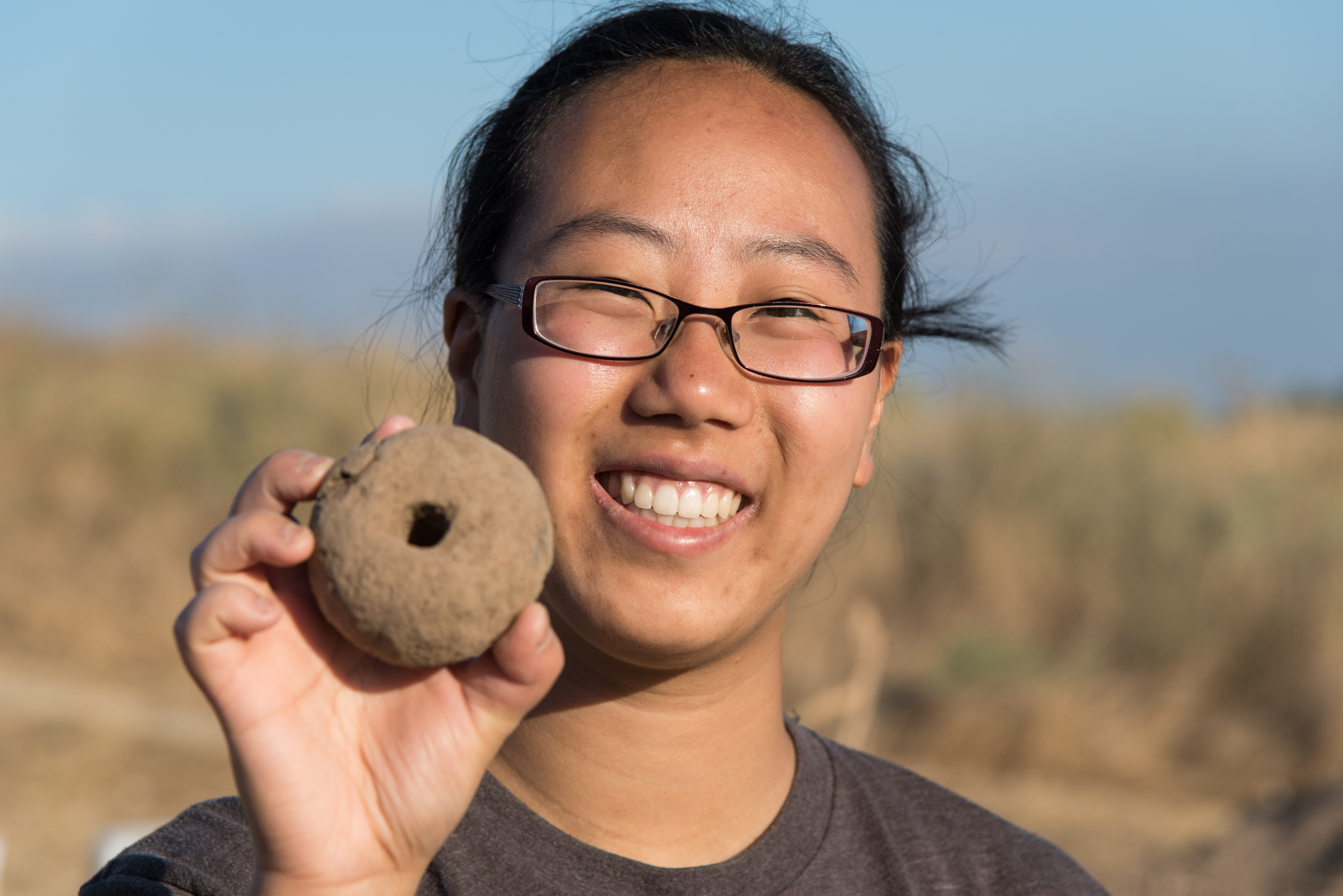 someone holding a rock