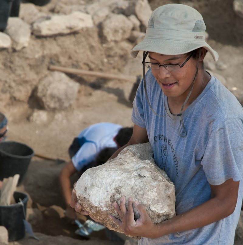 someone holding a rock