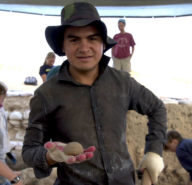 someone holding a rock