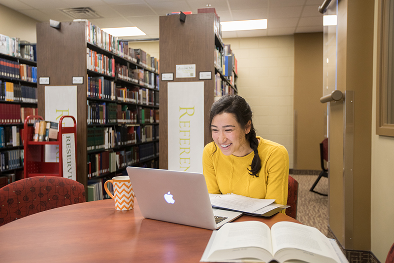 Woman studying in library