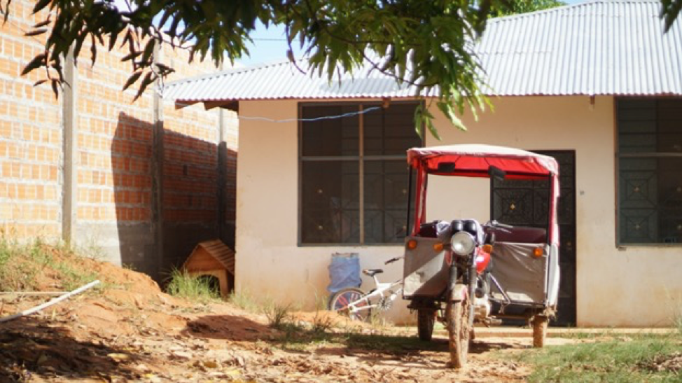 rickshaw outside of a neighbor's home