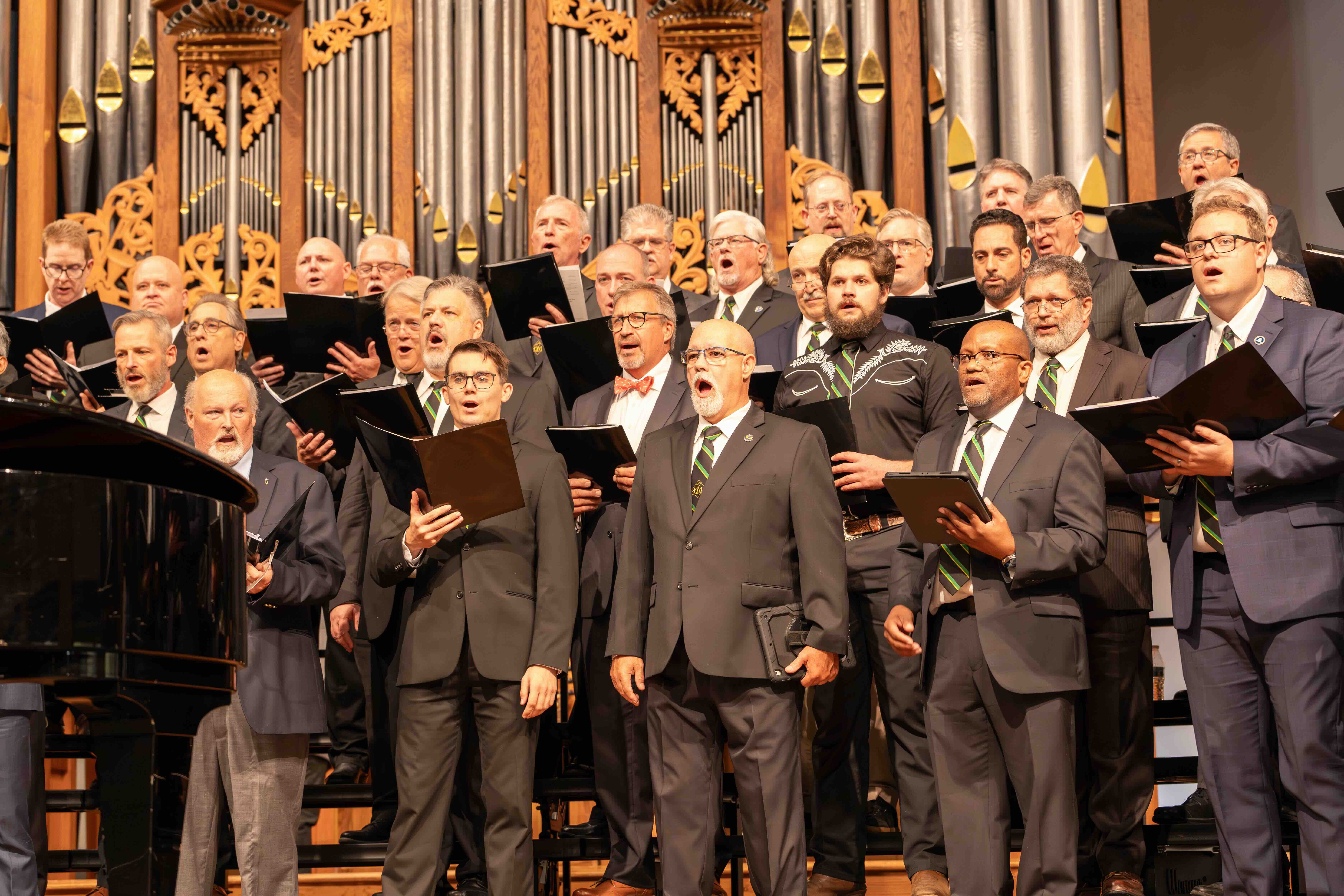 Homecoming Weekend Photo of the male Die Meistersinger chorus singing in the church