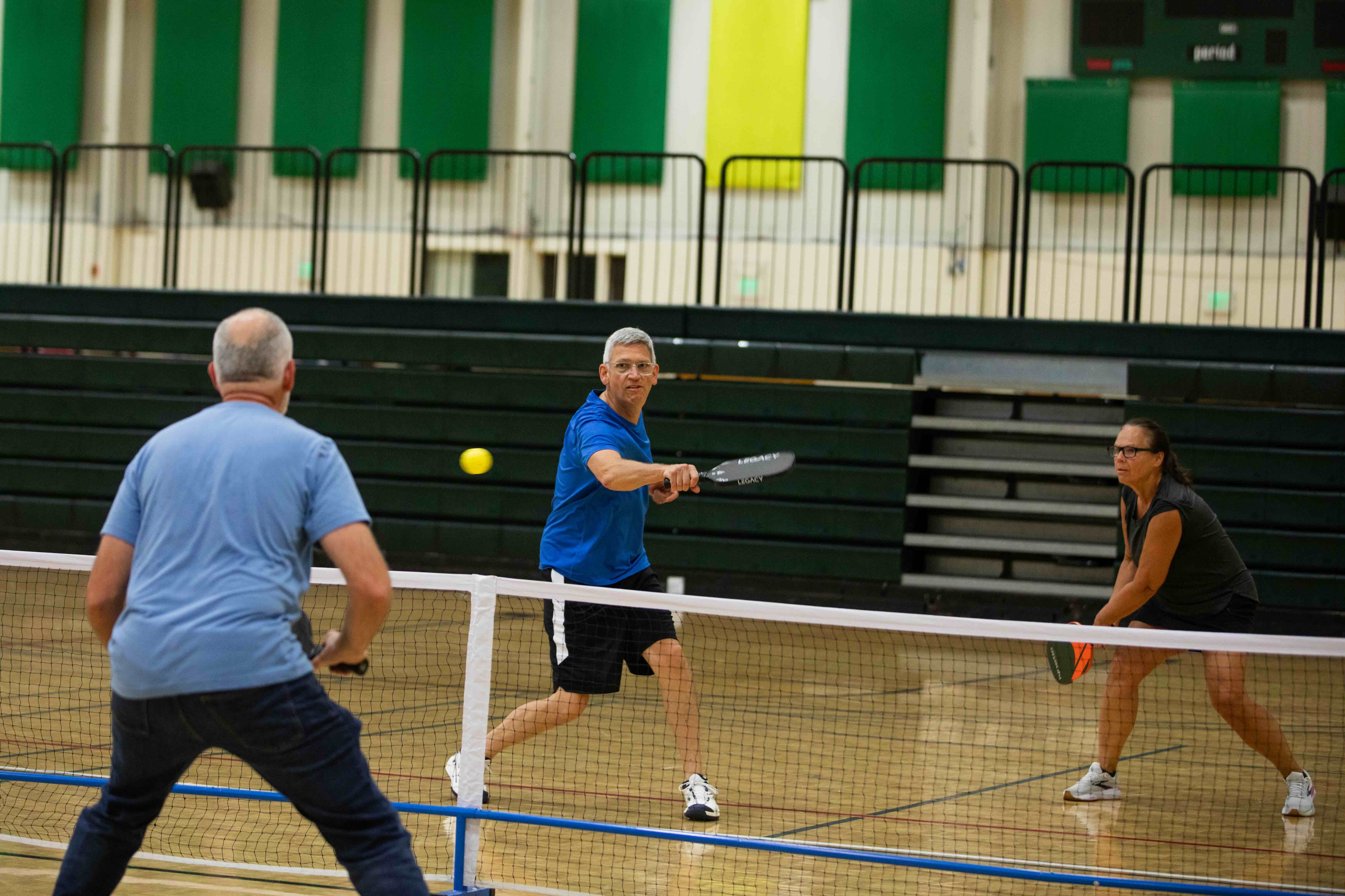 Homecoming Weekend Photo of alumni playing pickle ball in the gymnasium