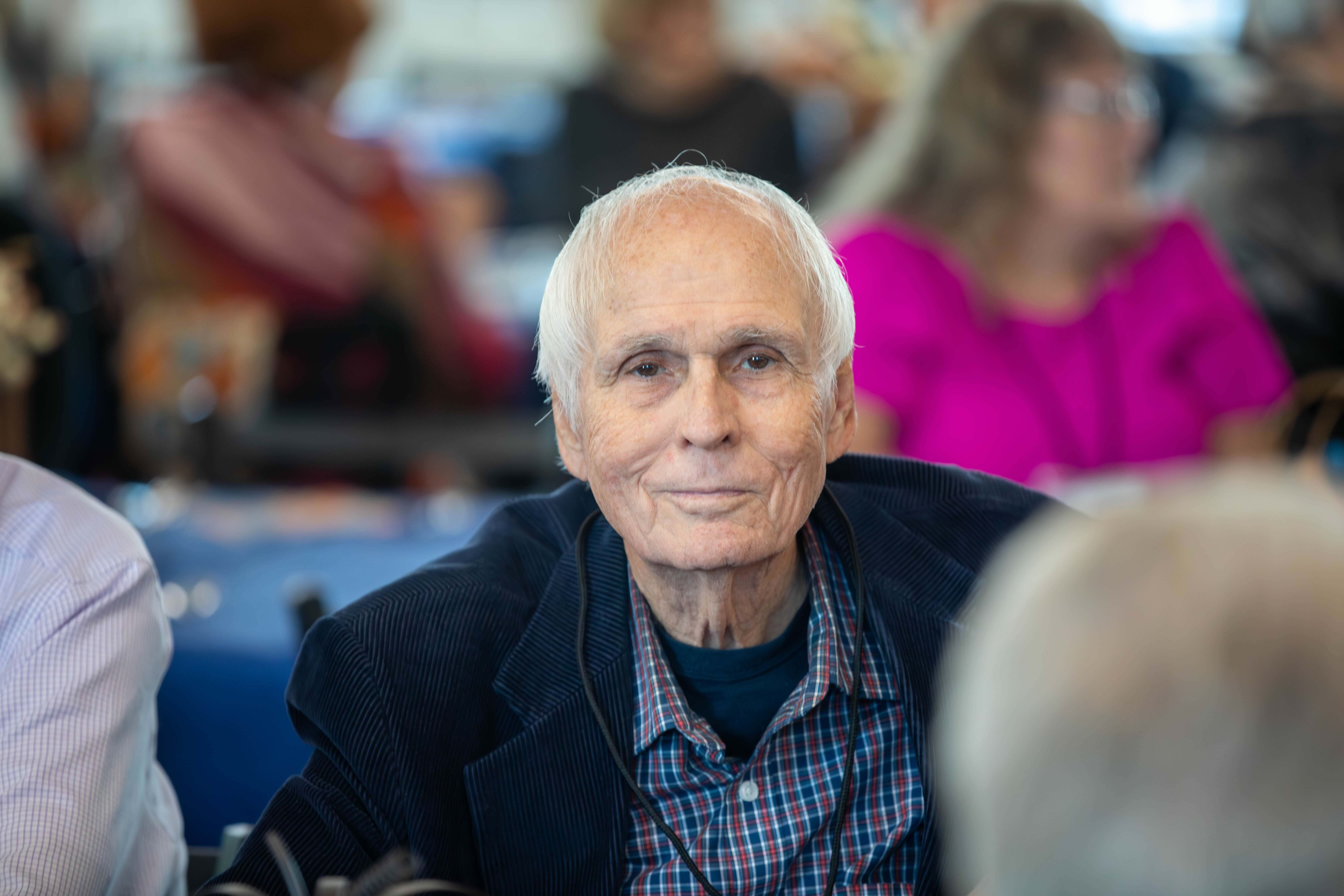 Homecoming Weekend Photo of a man at table looking at the camera