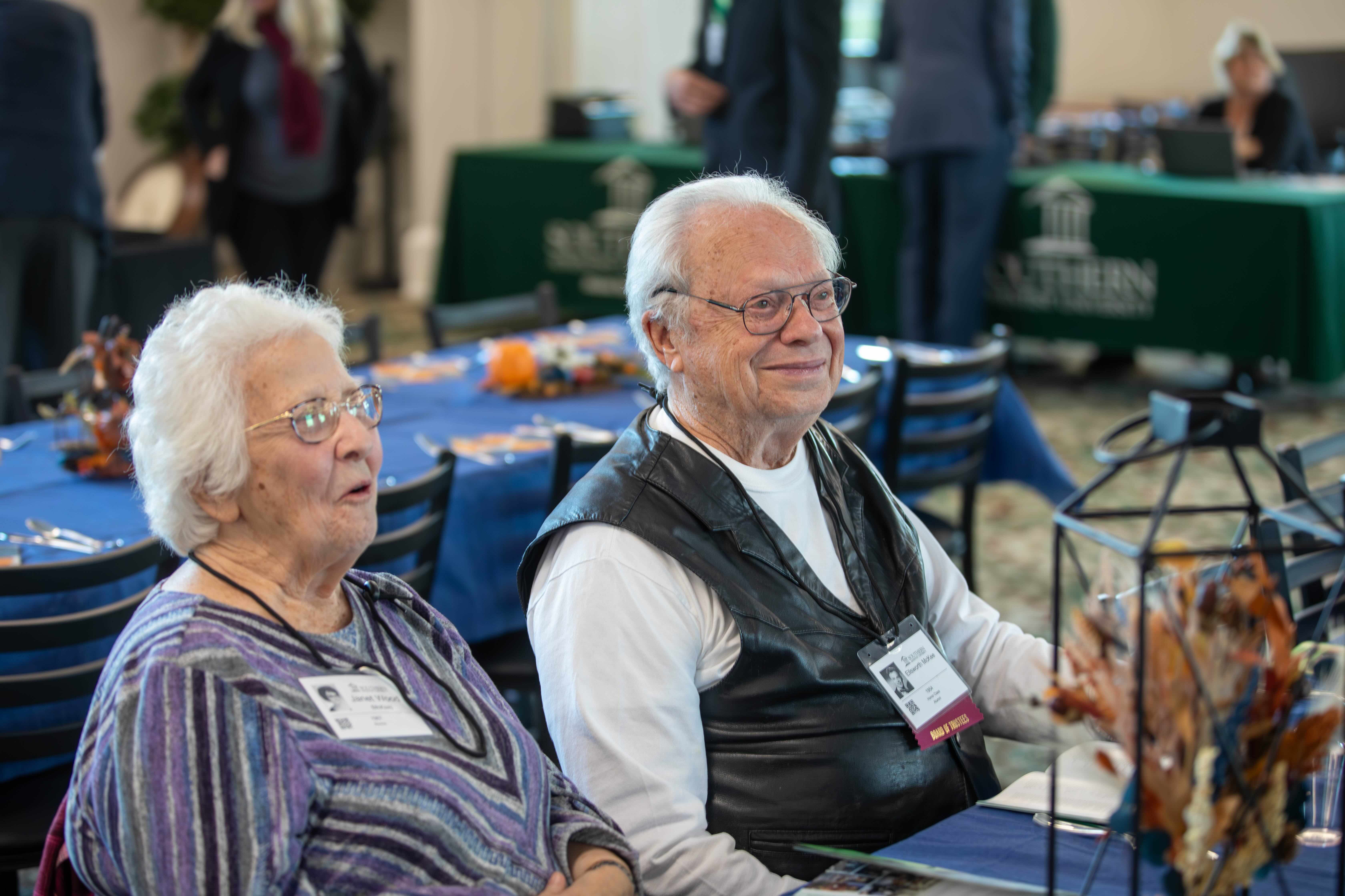 Homecoming Weekend Photo of a 2 alumni smiling 