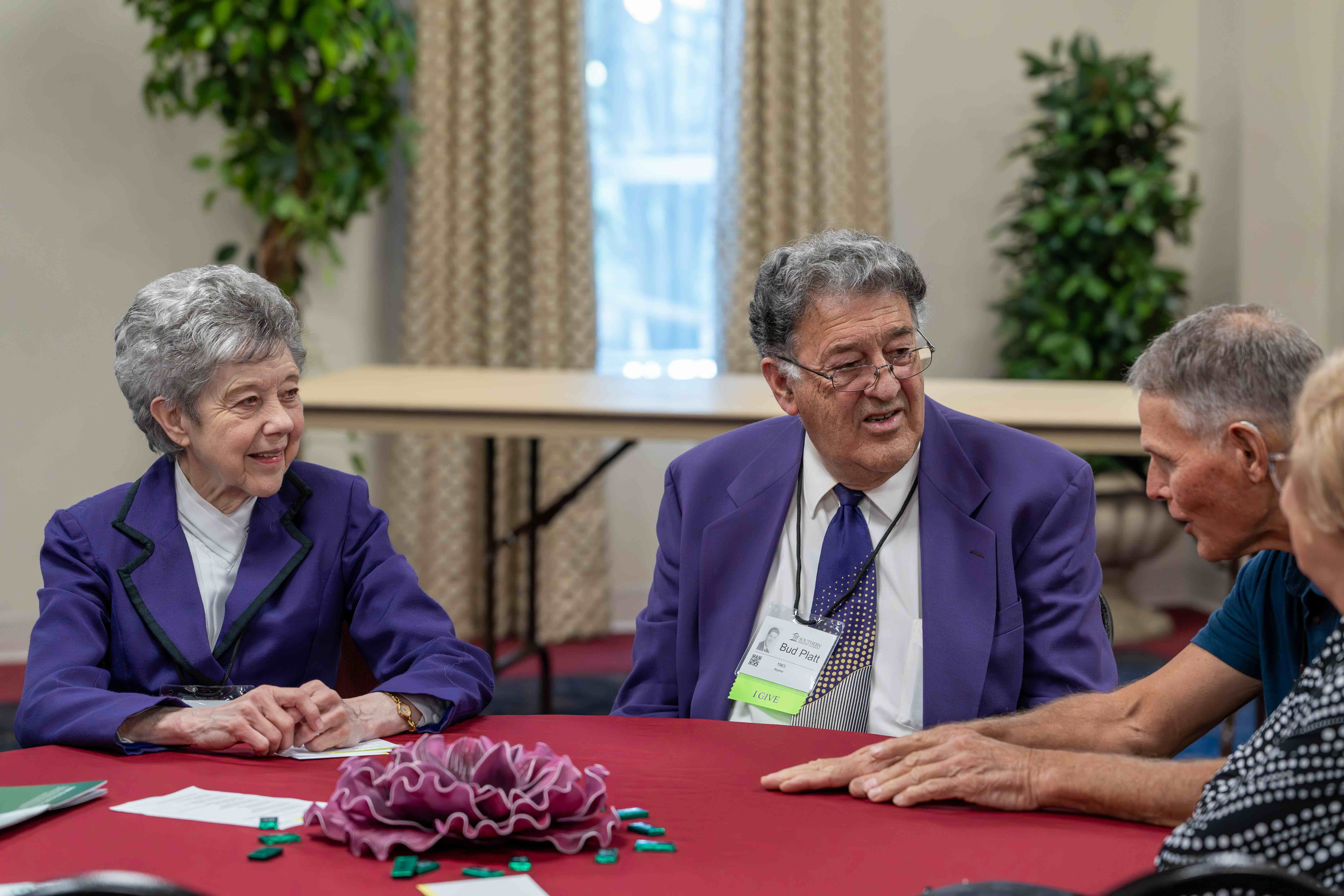 Homecoming Weekend Photo of an alumni couple in matching purple jackets