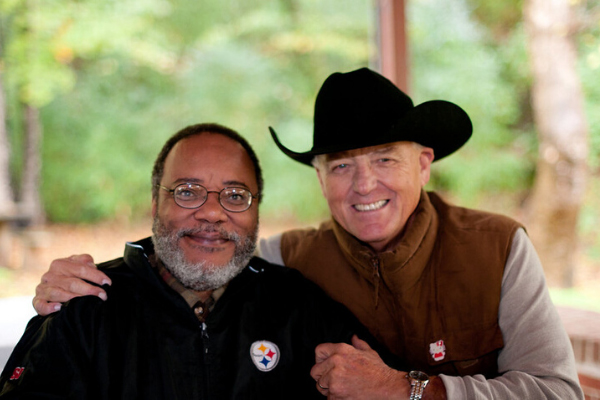 Two alumni posing together