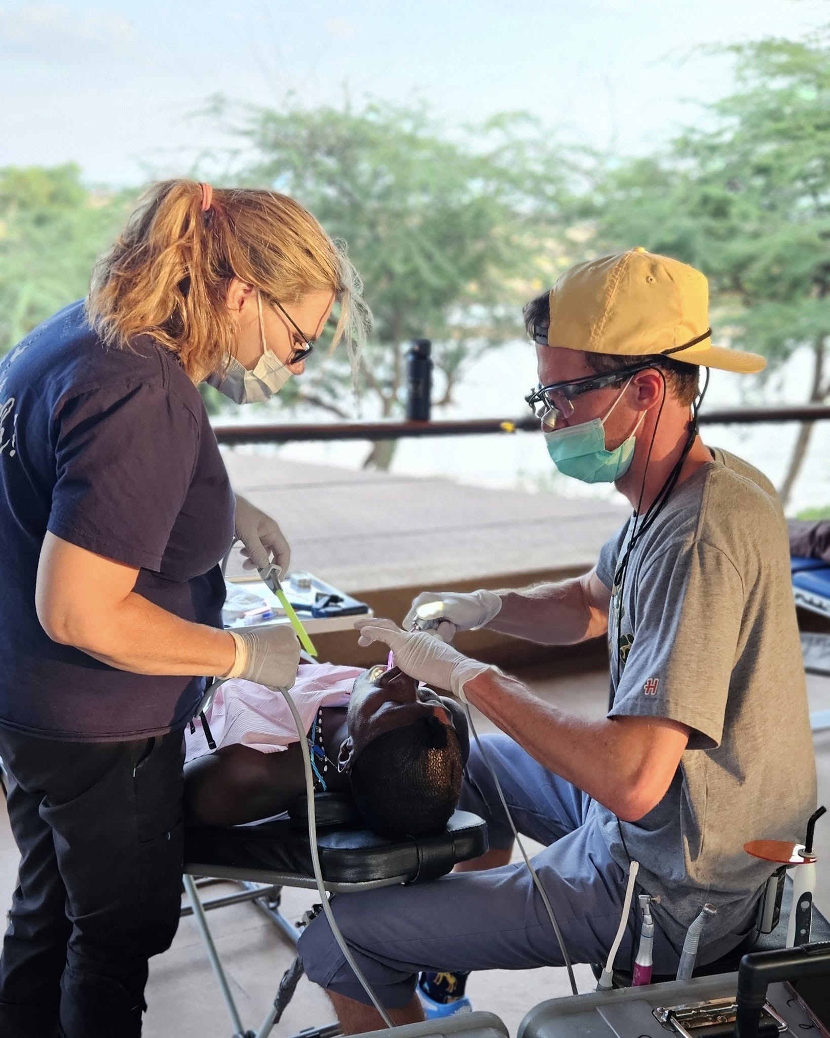 Student missionary assists in dental work