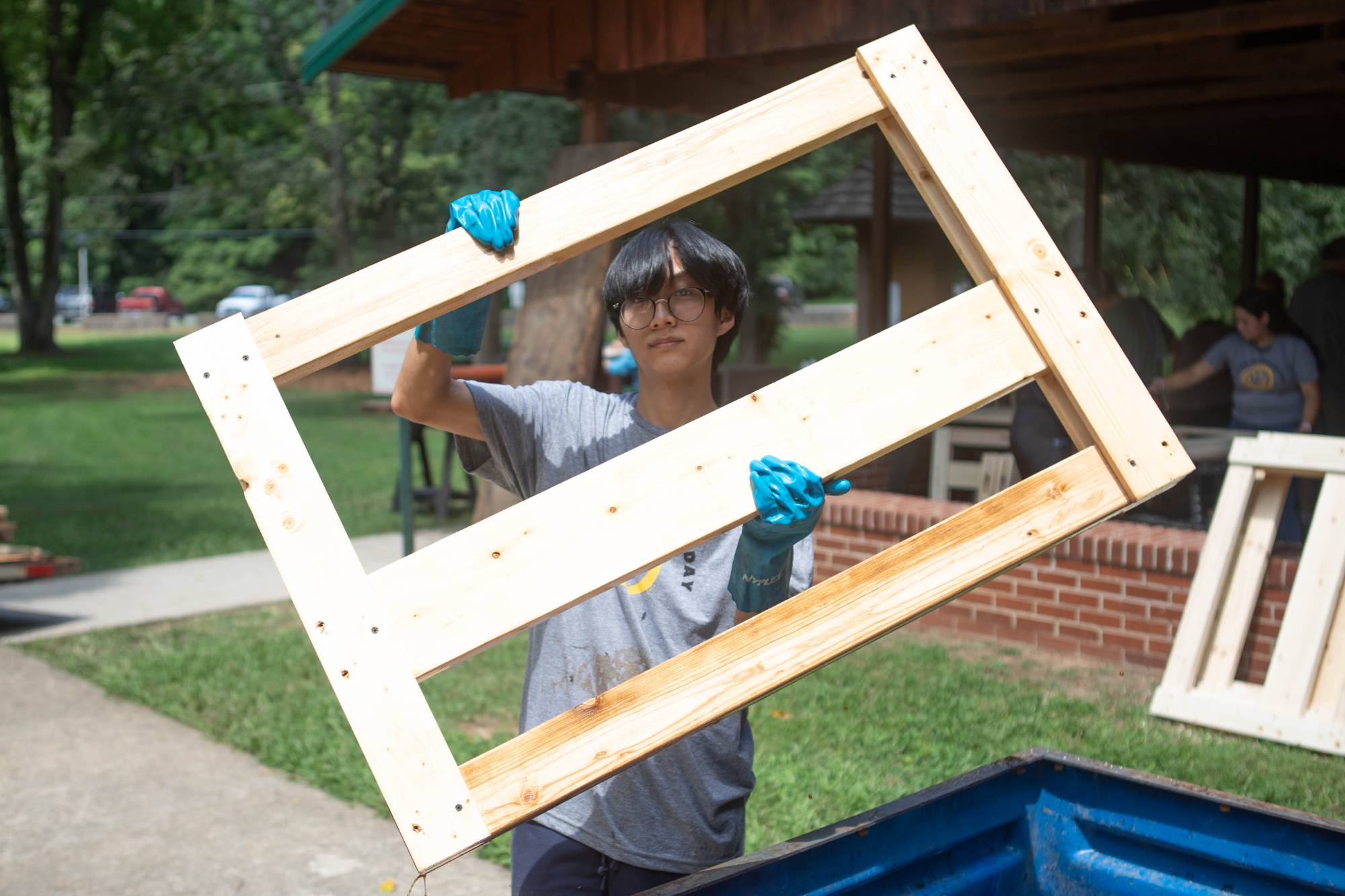 Freshman shows of his work while volunteering with the organization Sleep in Heavenly Peace