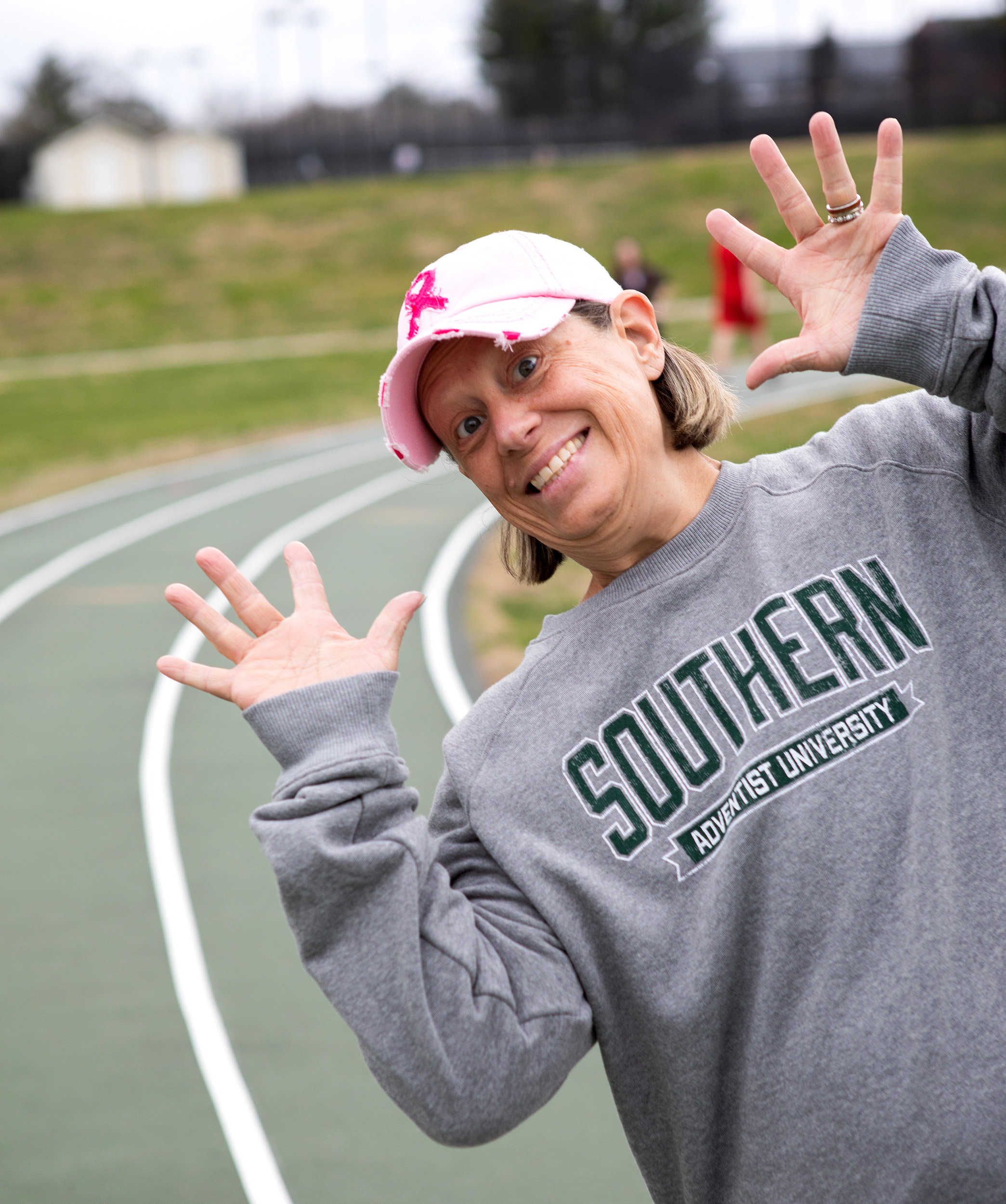 Tamara Ritterskamp, assistant professor in the School of Health and Kinesiology, walks on the track outside Hulsey Wellness Center.