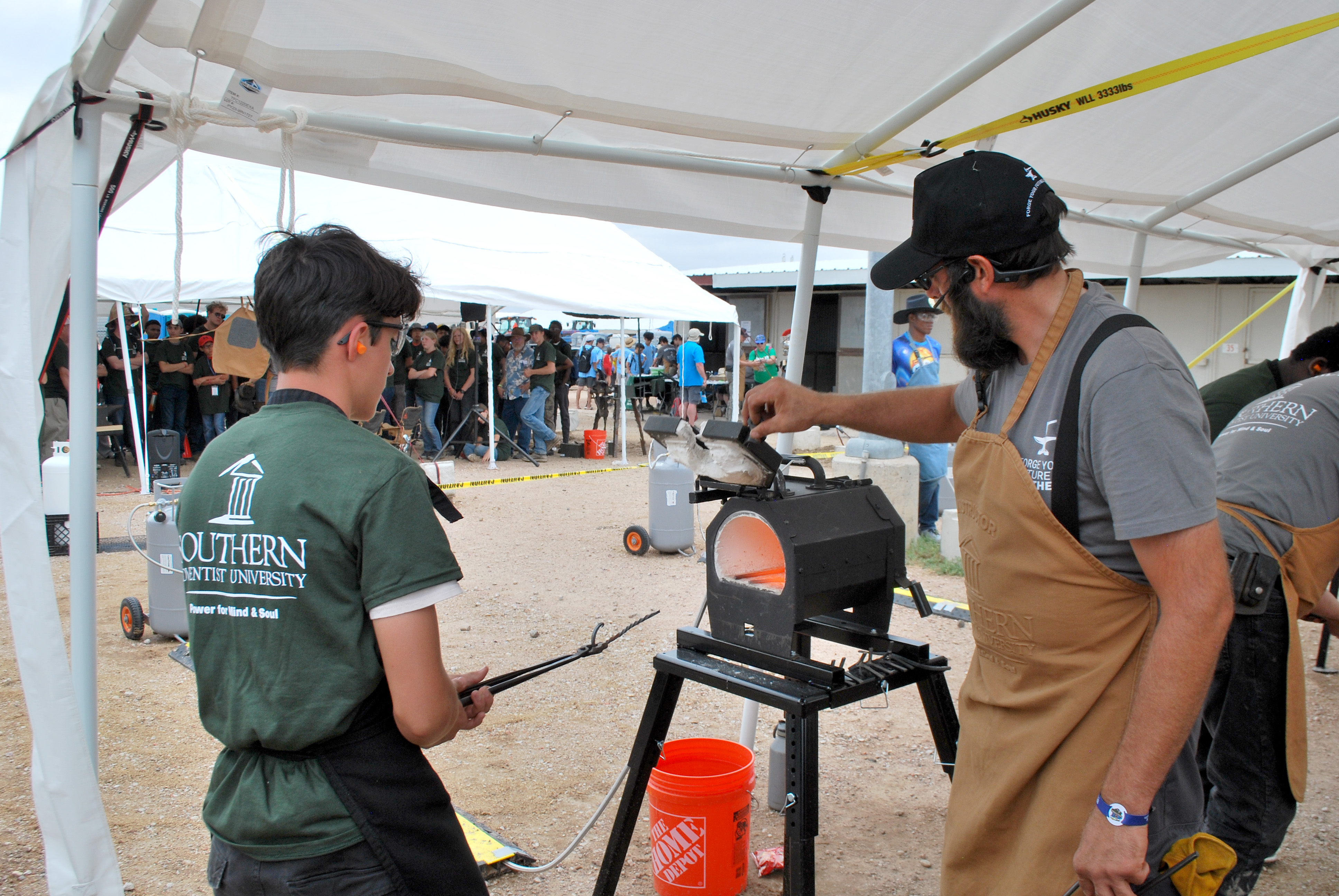 SAU member of Blacksmithing club doing a metal art