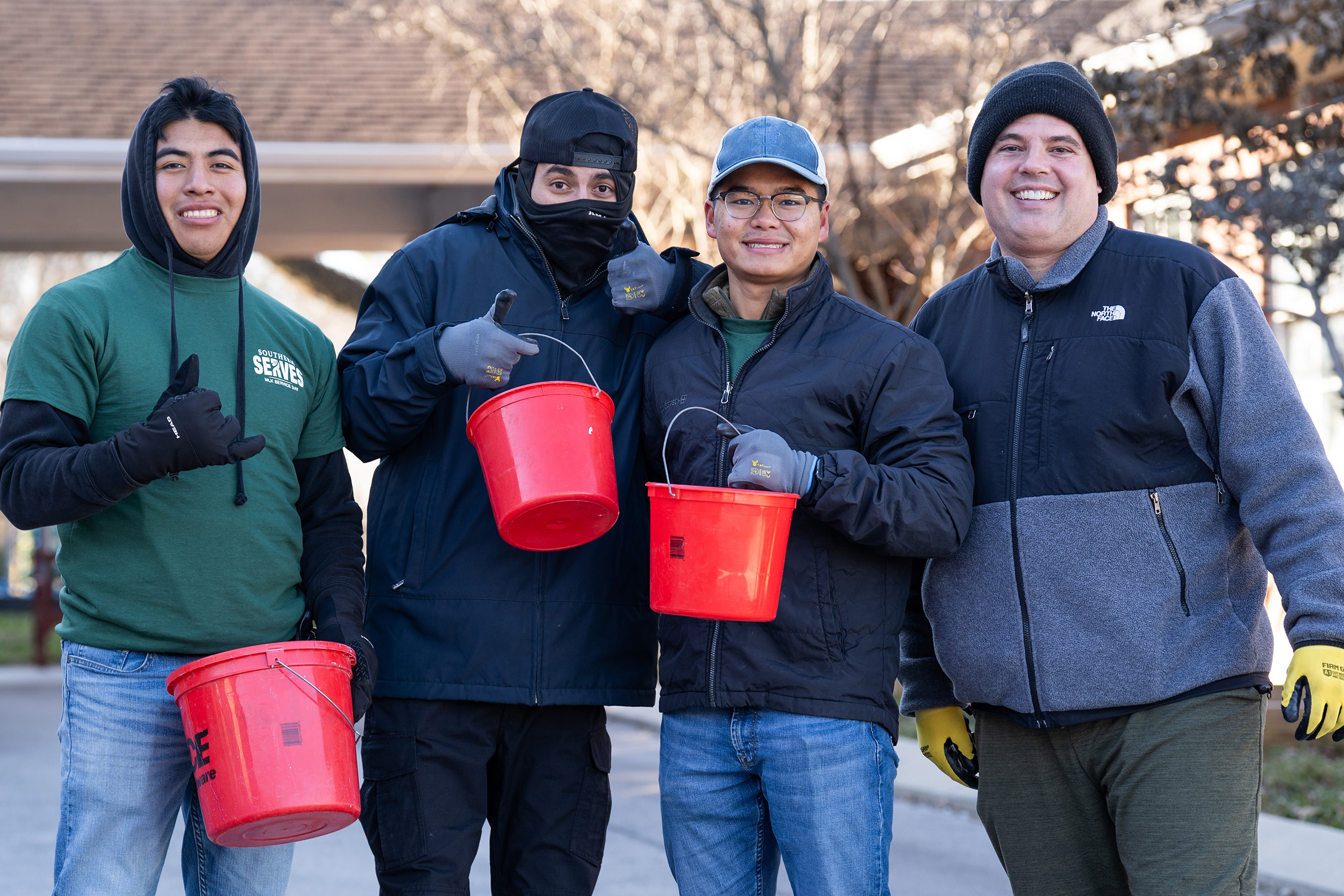 a group of volunteers smile for the camera