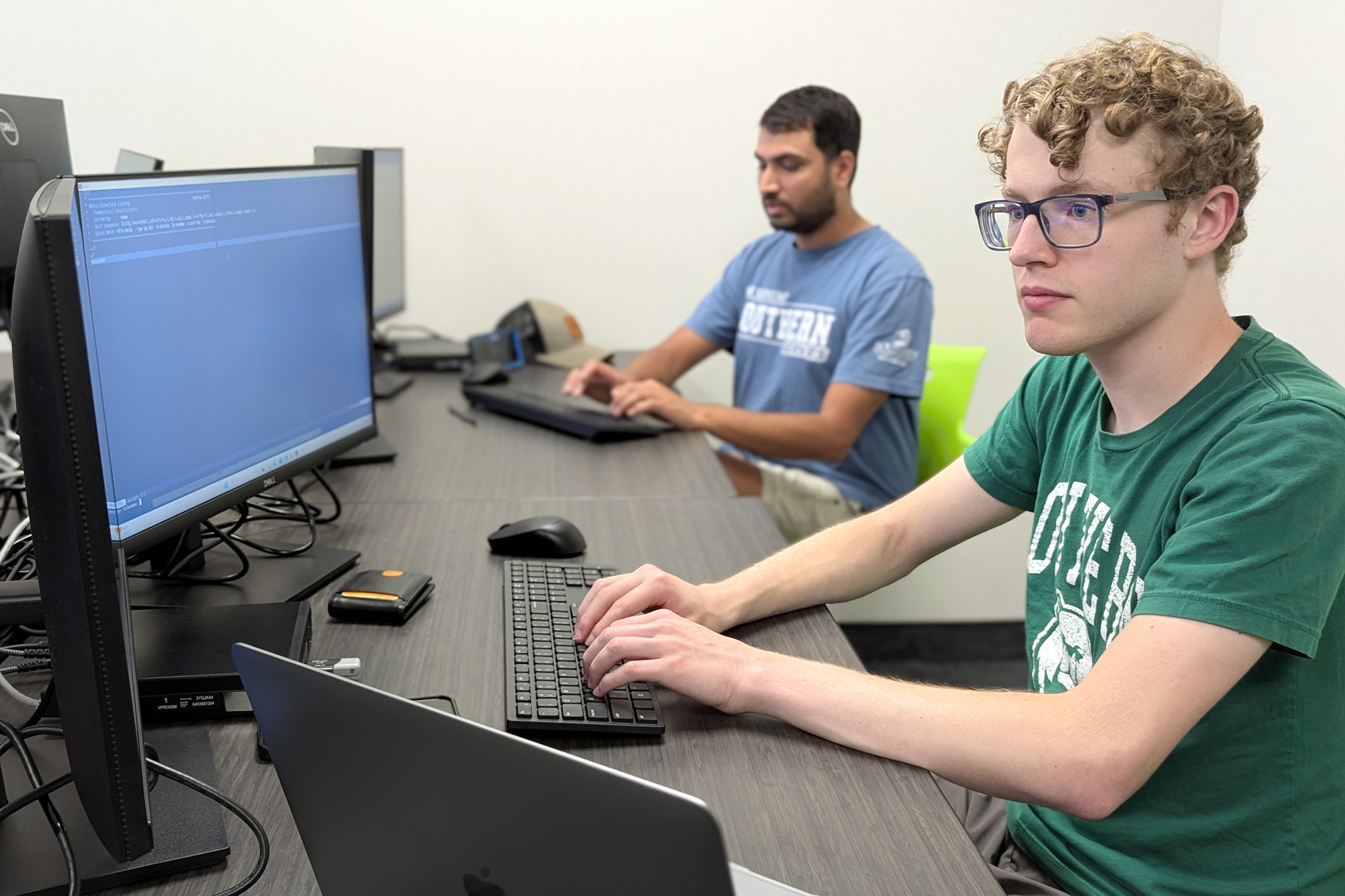 students sit at computers