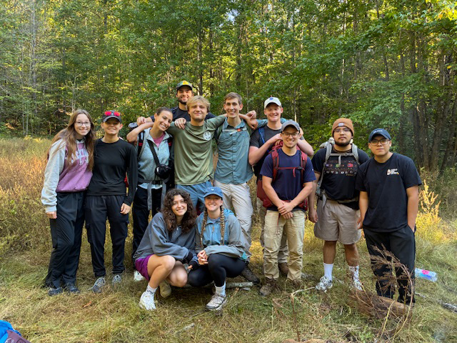 A group photo of students on a backpacking trip