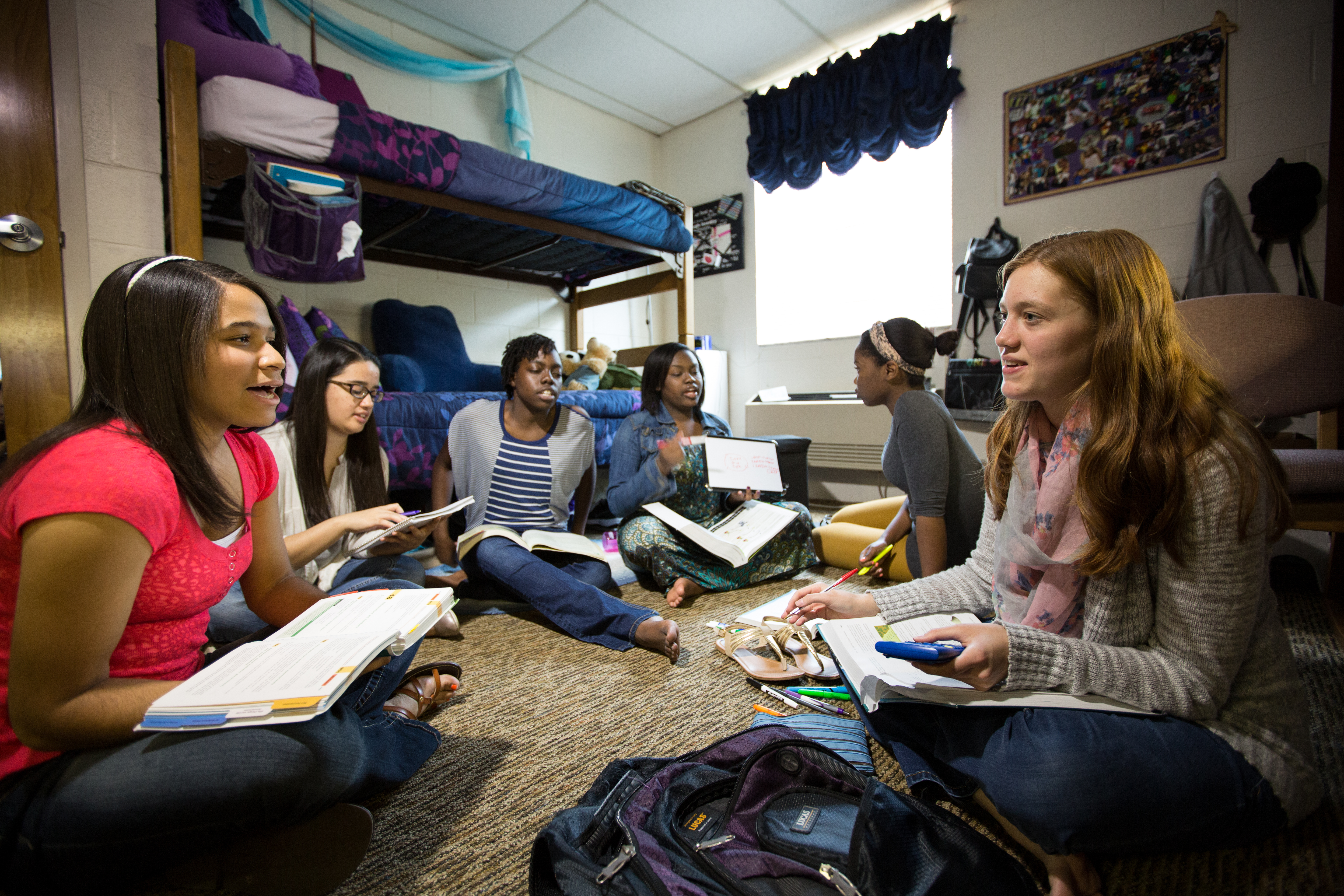 girls sitting in a dorm