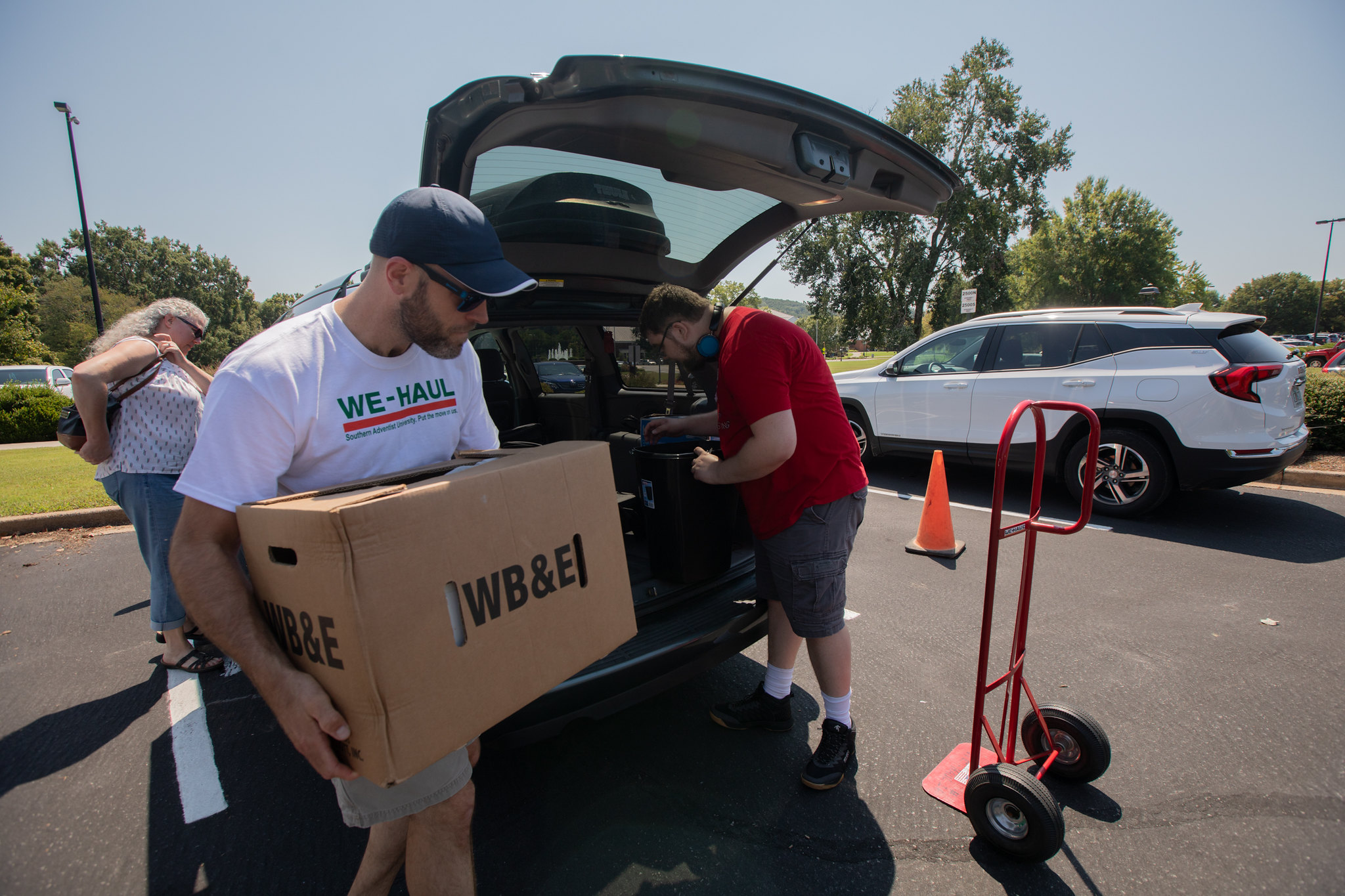 people carrying a box